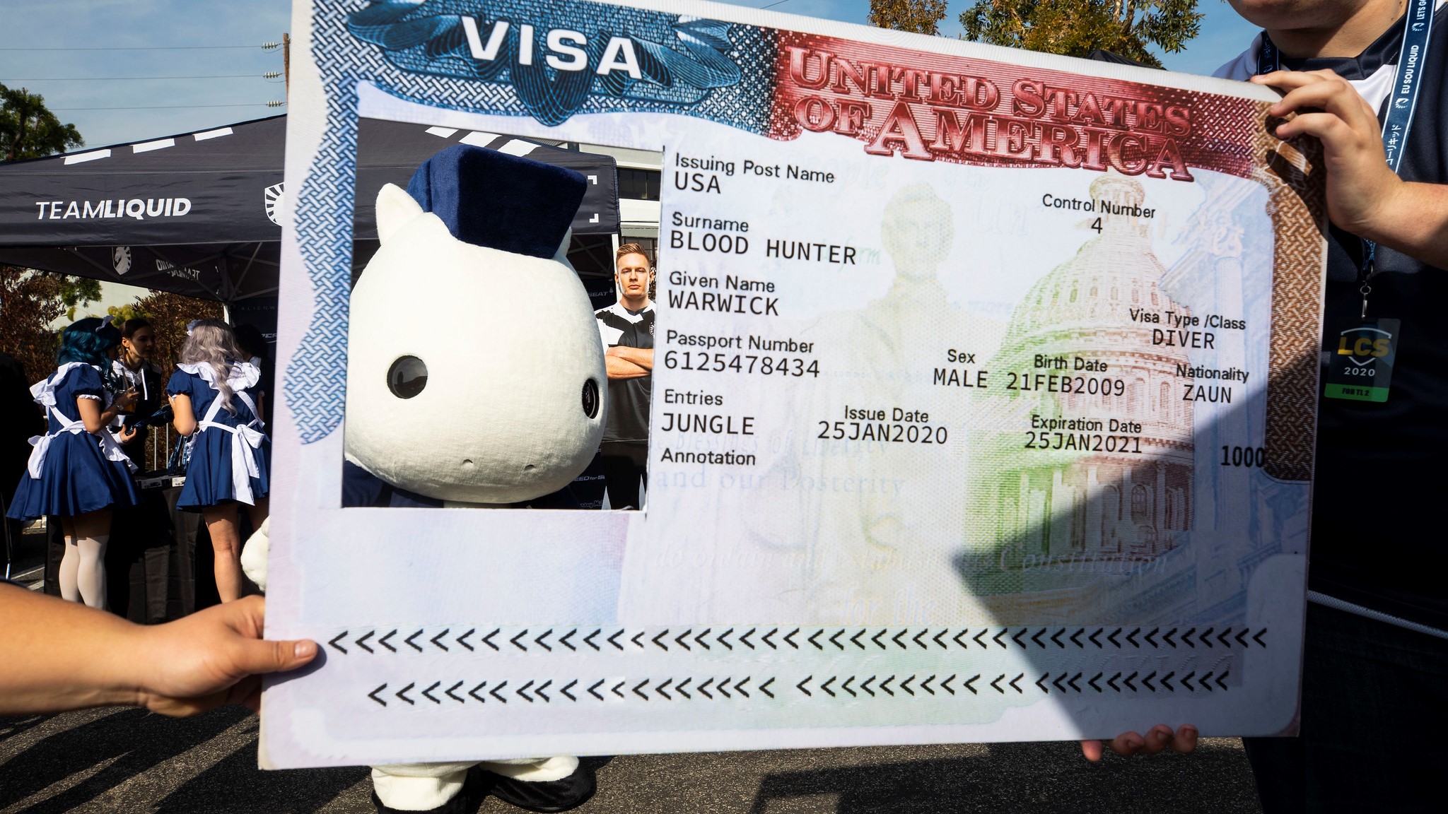 Team Liquid's mascot poses in a Visa Card cut out.