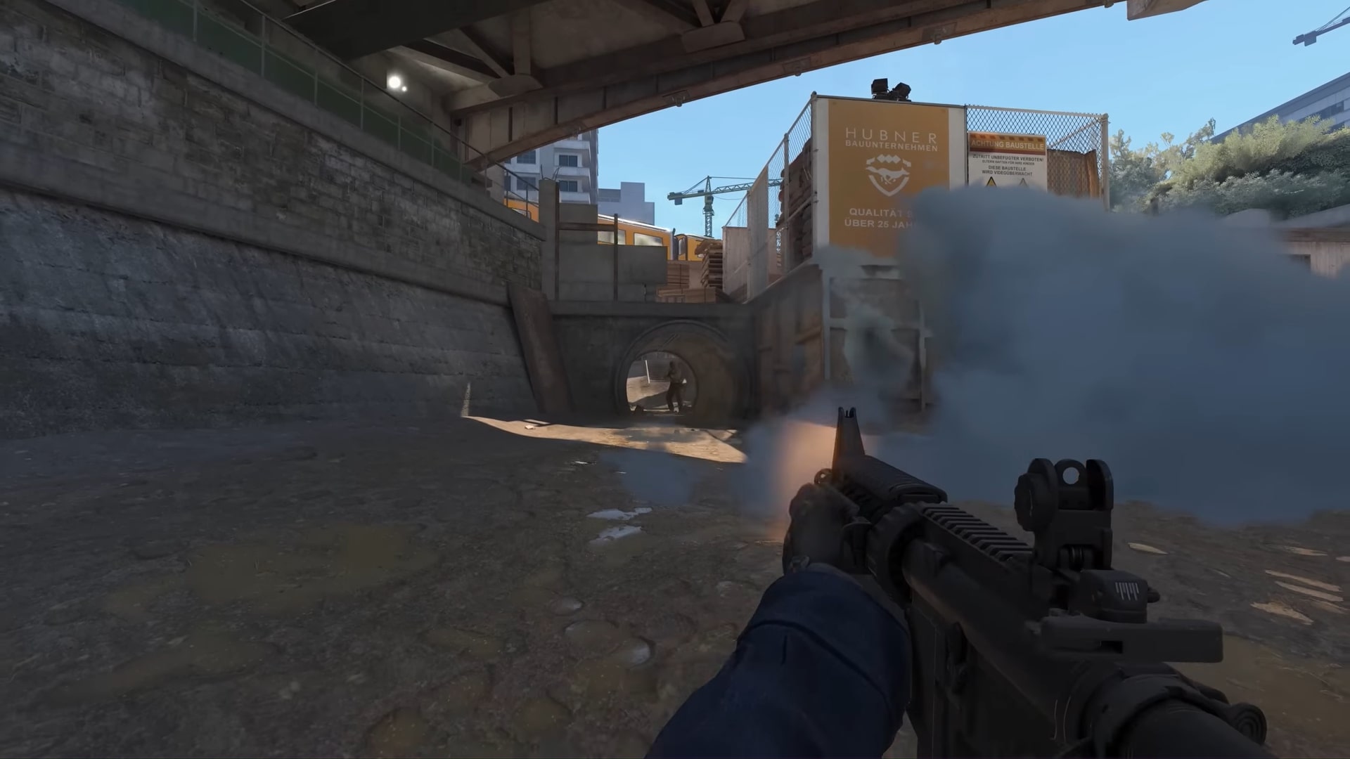 A player shoots through a smoke screen in Counter-Strike 2.